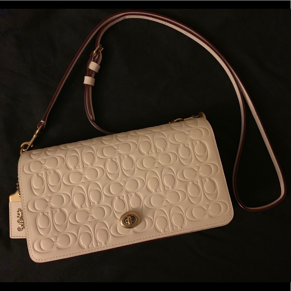Coach “Dinky in Signature Leather”